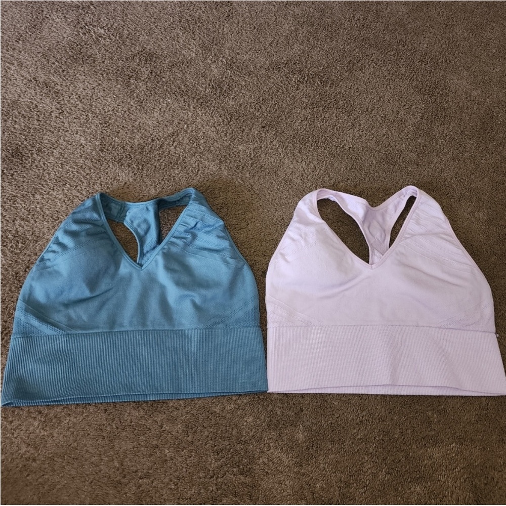 Two Victoria’s secret PINK sports bras. In good condition. Size Large